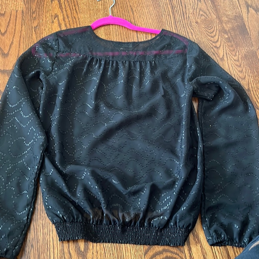 Long sleeve black blouse with simple detailing and sliver shimmer